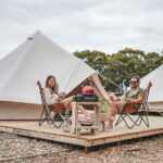 Relaxing on the deck of the Bellbird Tents Tathra Beach Eco Camp